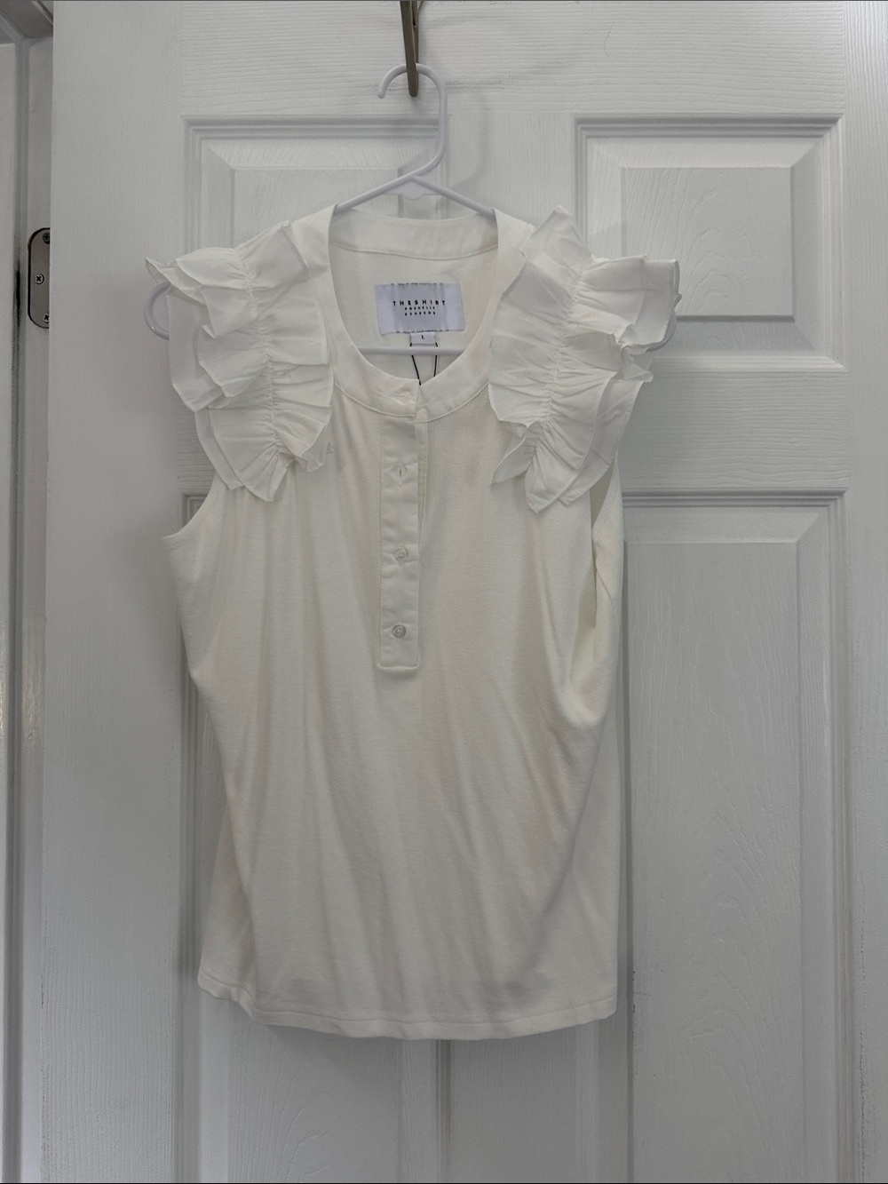 The Shirt - Rochelle Behrens Sleeveless Ruffle Henley Top - White